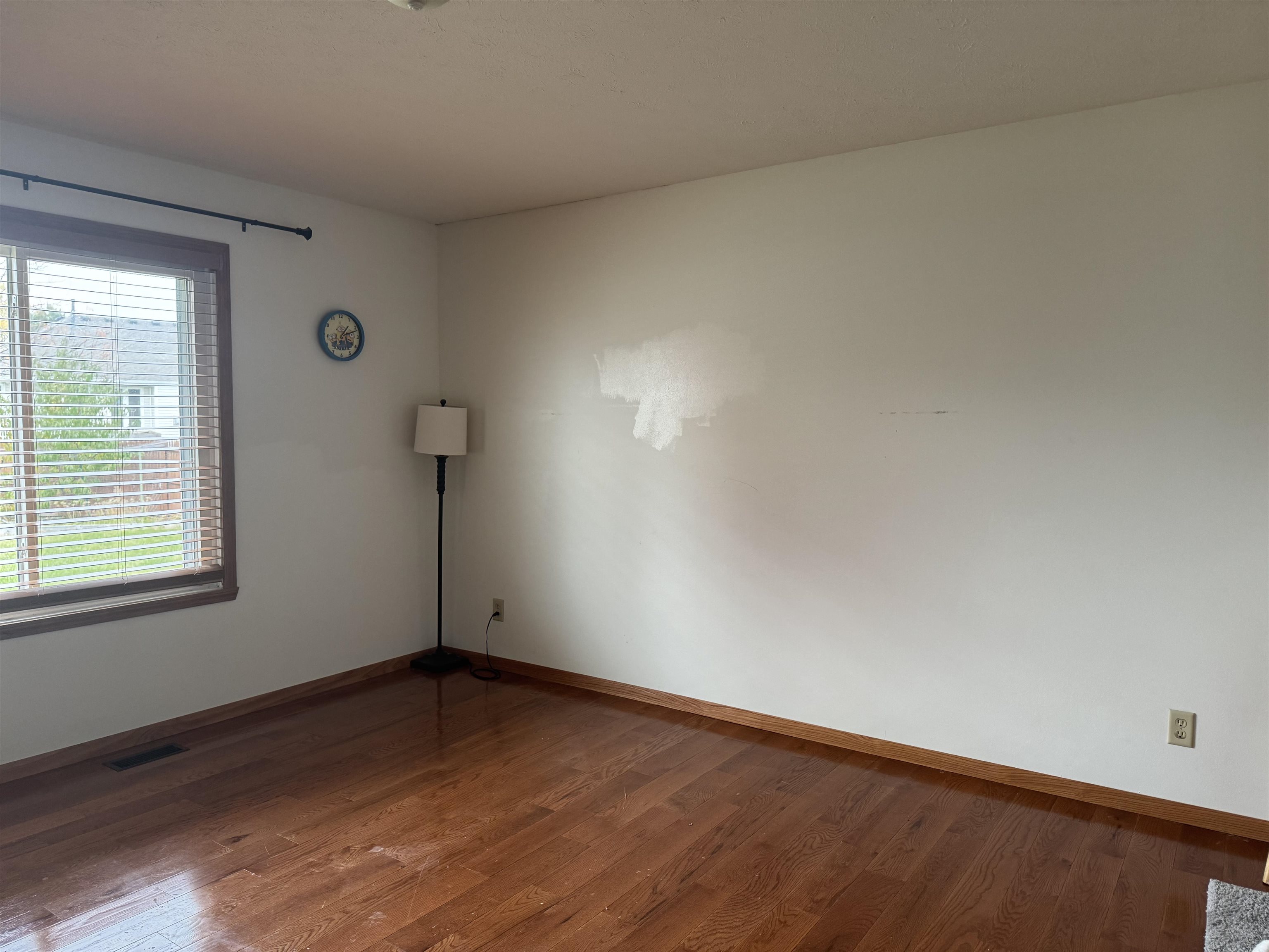 1916 Prestwold Place Machesney Park, IL 61115 - Photo 6 of 9 an empty room with wooden floor and windows