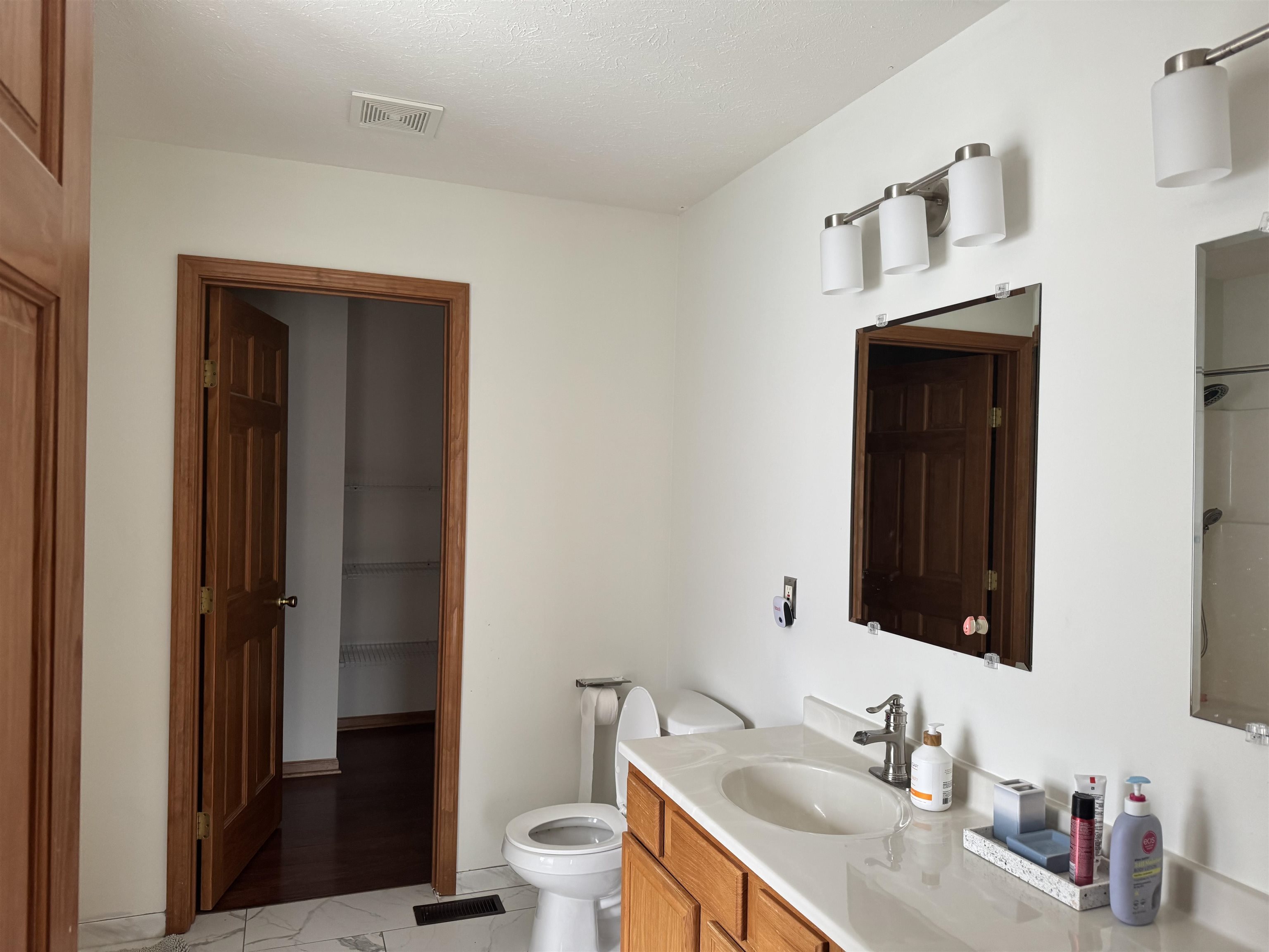 1916 Prestwold Place Machesney Park, IL 61115 - Photo 7 of 9 a bathroom with a granite countertop sink toilet and shower