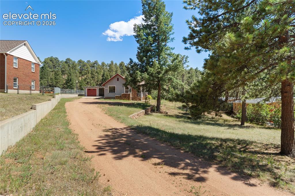 7755 Topeka Avenue Cascade, CO 80809 - Photo 2 of 38 you can see the long driveway with plenty of room