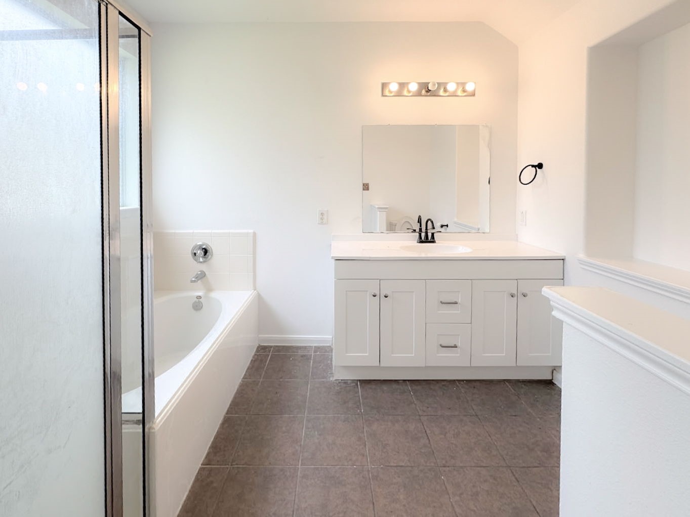 23526 Whispering Maple Drive Spring, TX 77373 - Photo 11 of 26 a spacious bathroom with a bathtub sink and a mirror