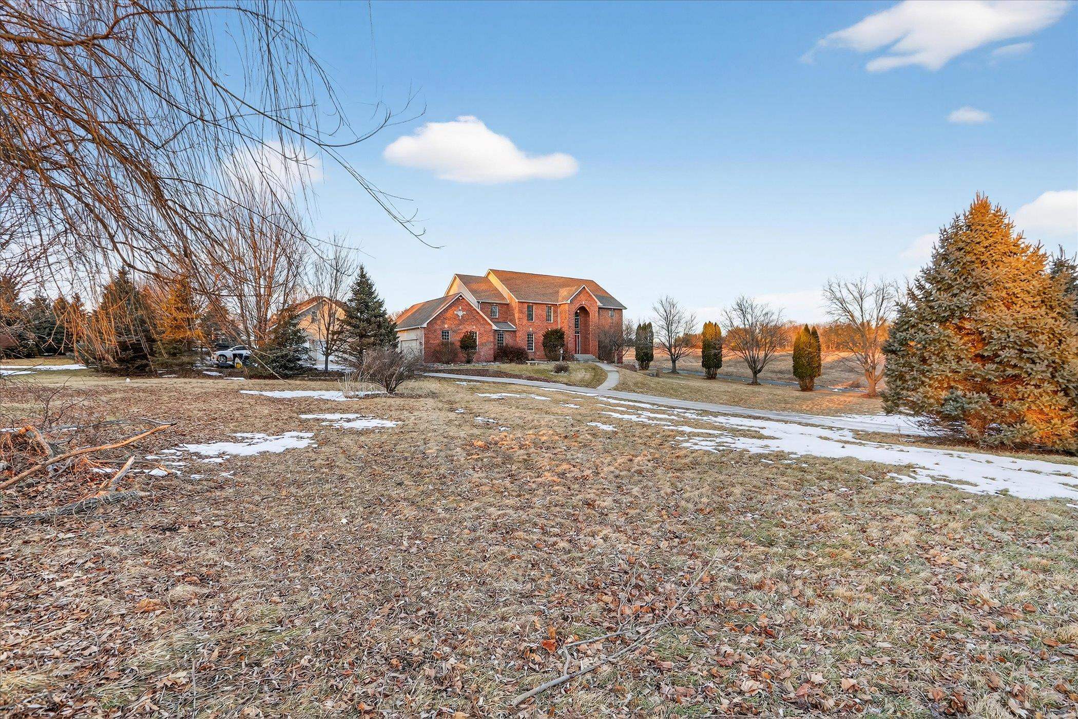 8306 East Crockett Road Roscoe, IL 61073 - Photo 1 of 61 a view of dirt road with a building