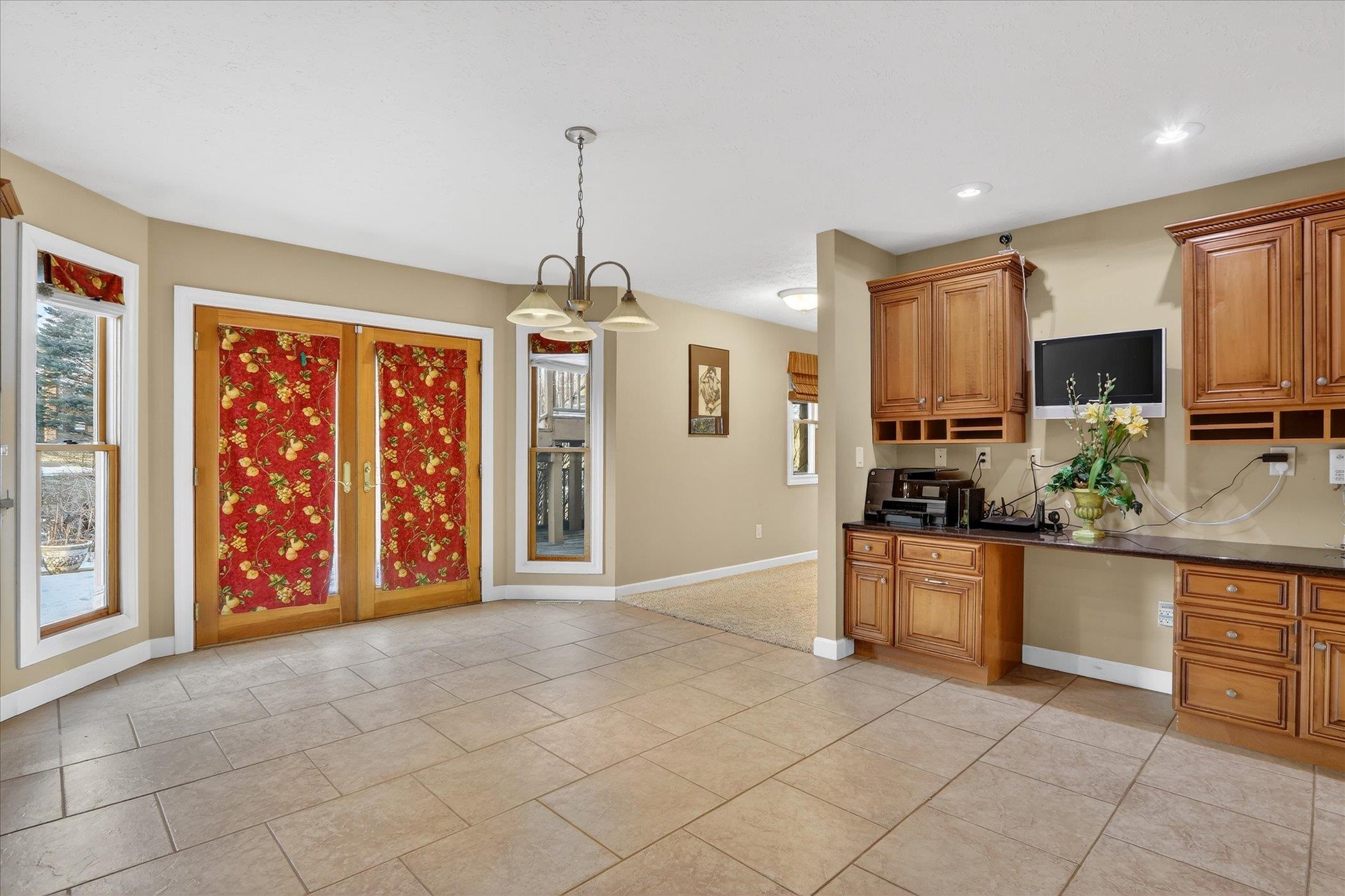 8306 East Crockett Road Roscoe, IL 61073 - Photo 21 of 61 a view of a kitchen with a sink