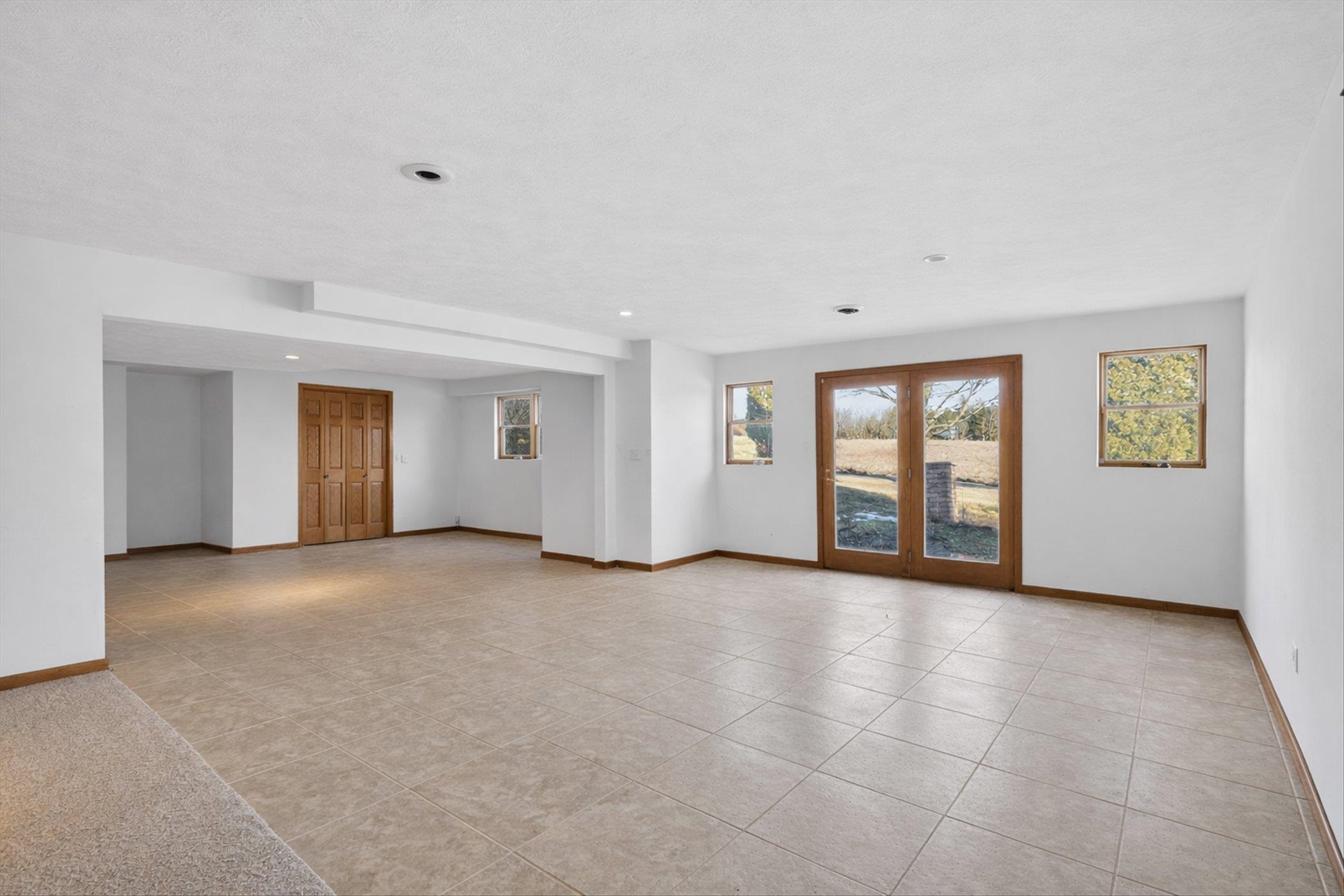 8306 East Crockett Road Roscoe, IL 61073 - Photo 22 of 61 a view of an empty room with a window