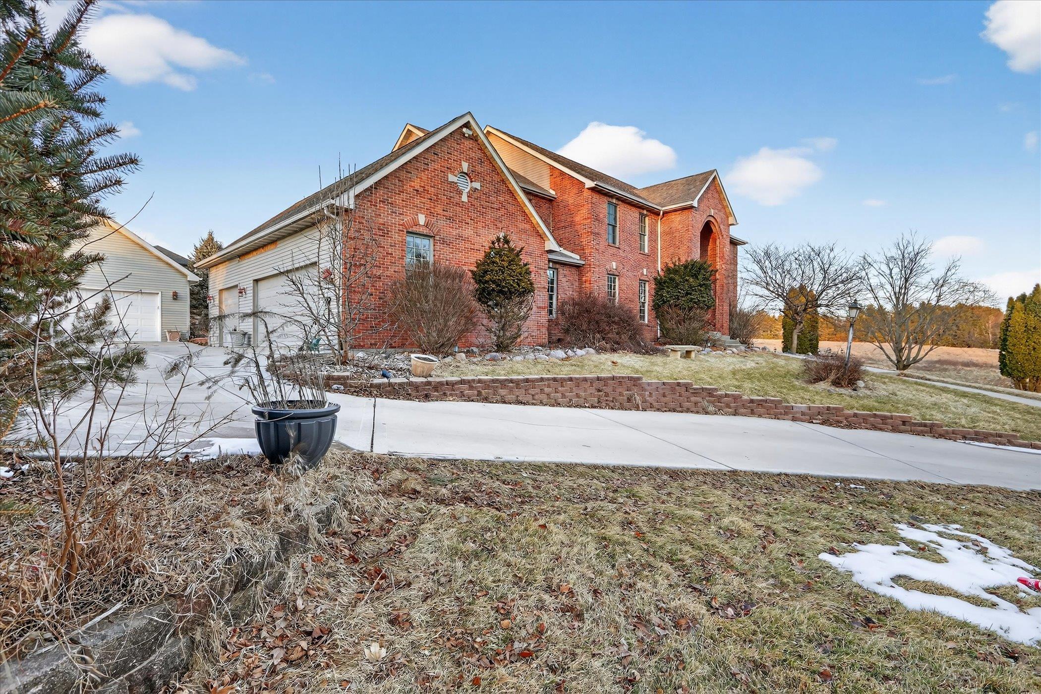 8306 East Crockett Road Roscoe, IL 61073 - Photo 24 of 61 a front view of a house with a yard