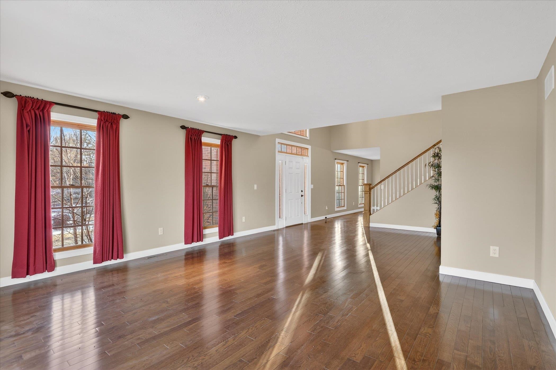 8306 East Crockett Road Roscoe, IL 61073 - Photo 35 of 61 a view of an entryway with wooden floor