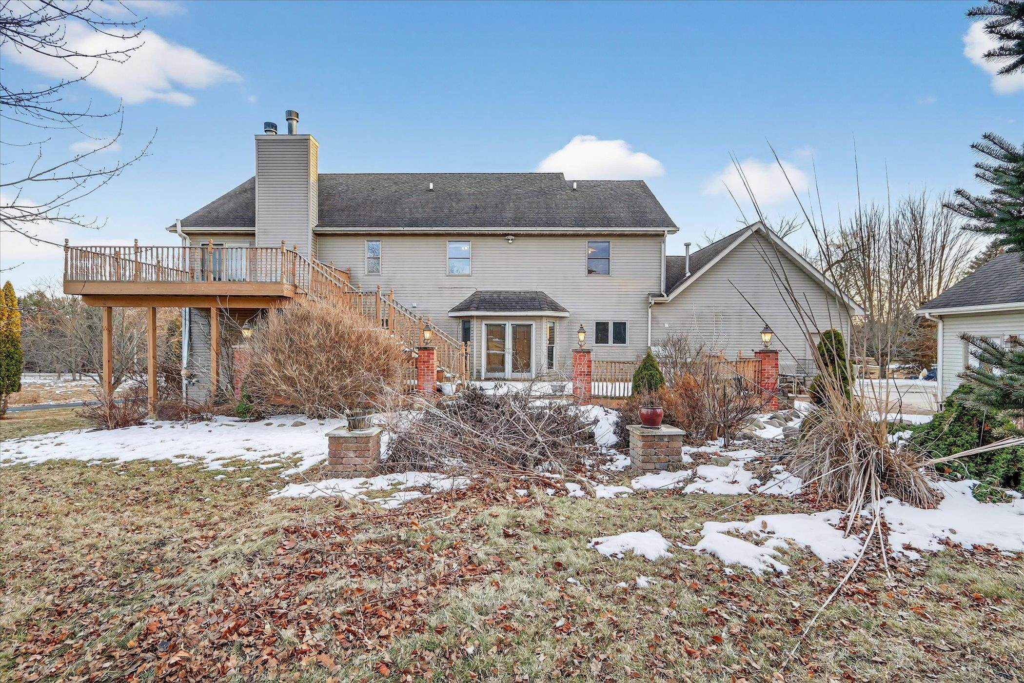 8306 East Crockett Road Roscoe, IL 61073 - Photo 57 of 61 a front view of a house with a yard