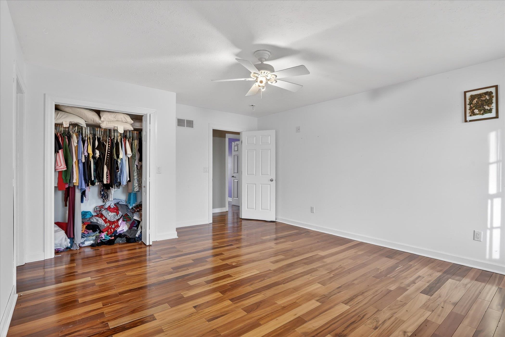 8306 East Crockett Road Roscoe, IL 61073 - Photo 8 of 61 a view of a room with toys and wooden floor