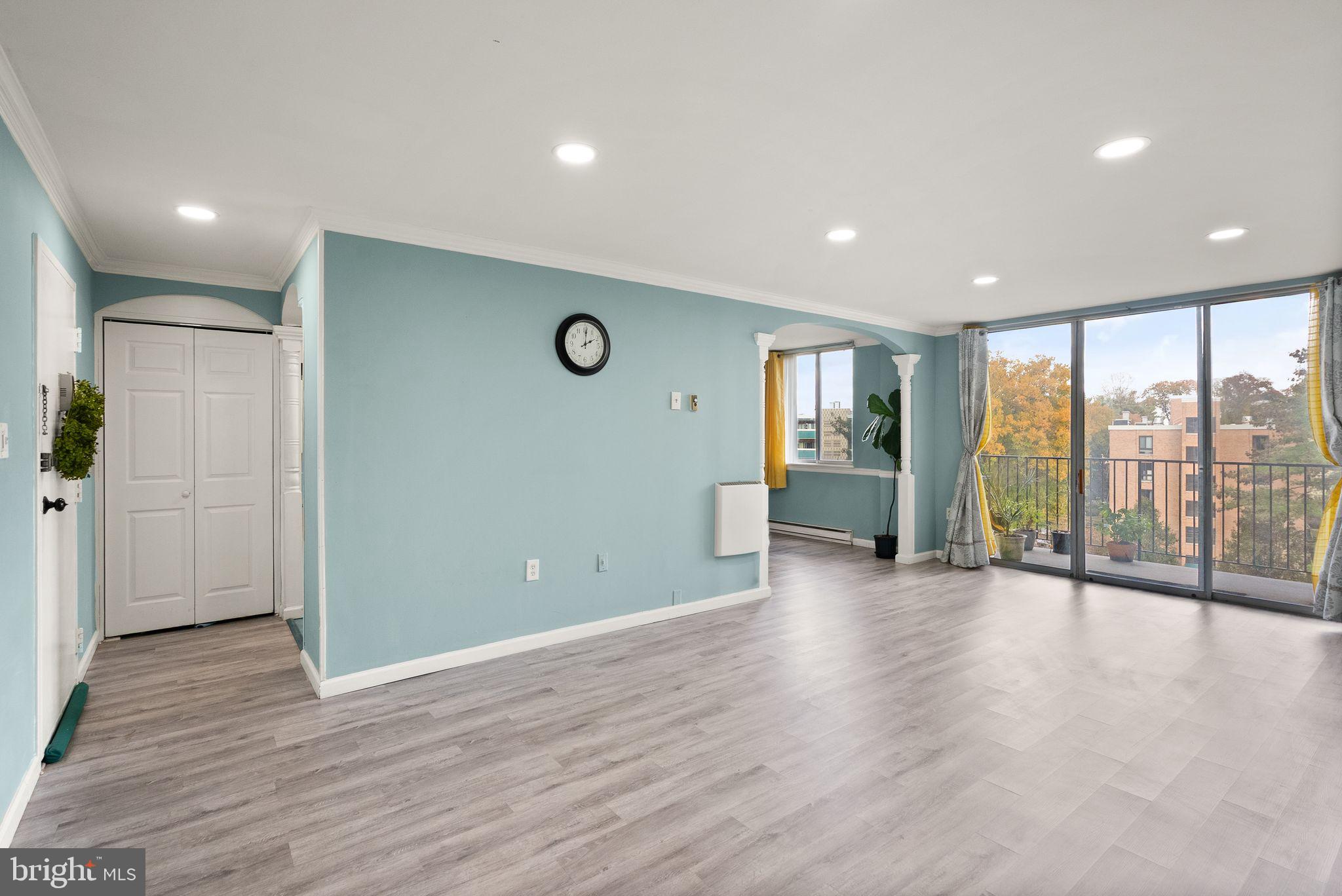 3245 Rio Drive, Unit 608 Falls Church, VA 22041 - Photo 11 of 36 a view of an empty room with wooden floor and a window