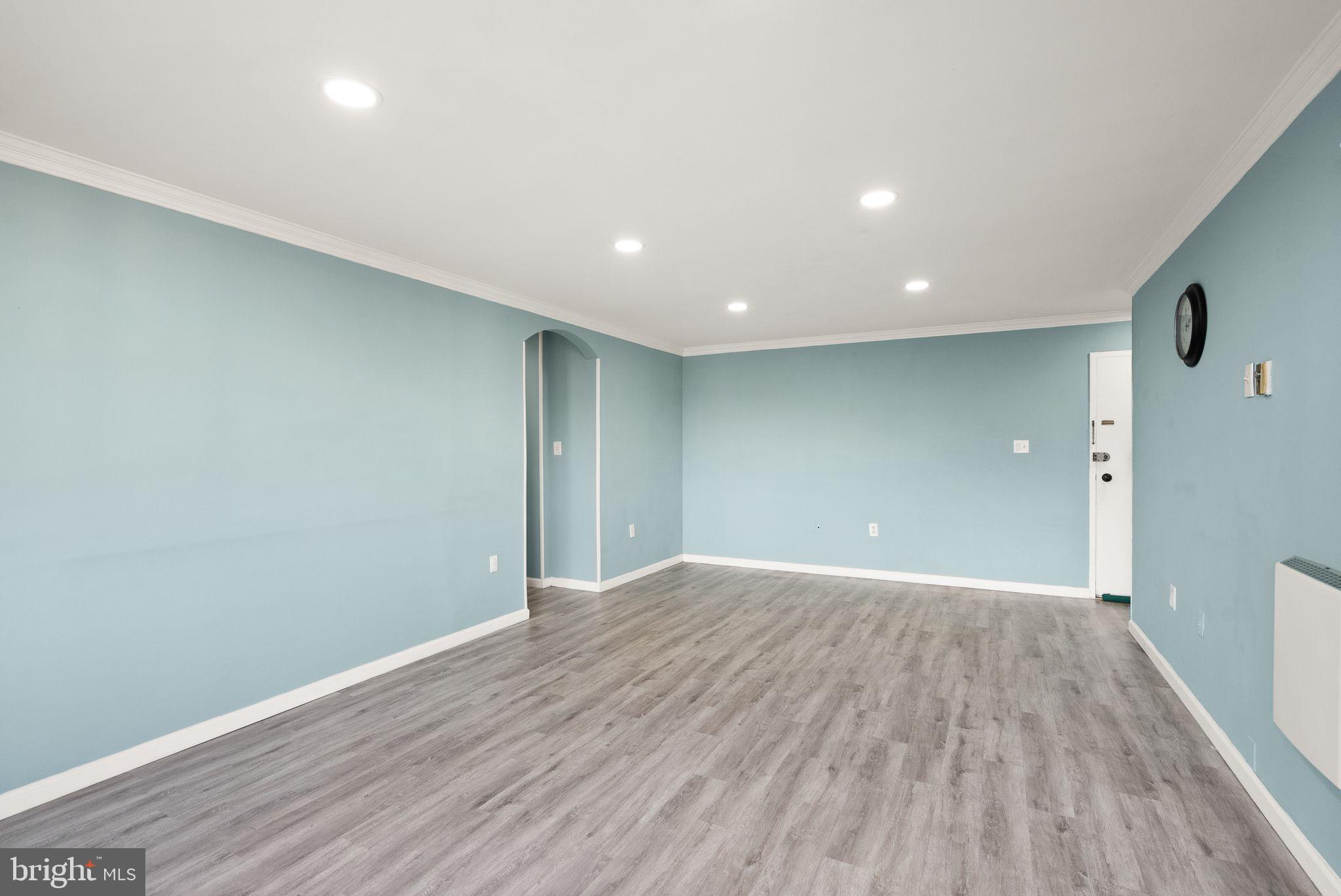 3245 Rio Drive, Unit 608 Falls Church, VA 22041 - Photo 13 of 36 a view of an empty room with wooden floor