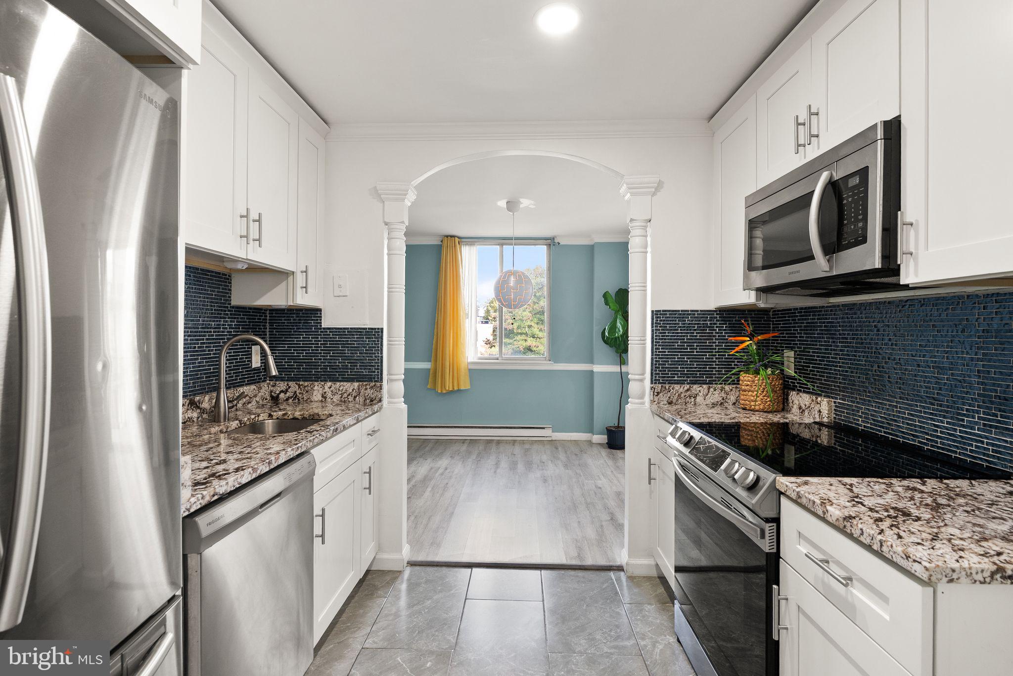 3245 Rio Drive, Unit 608 Falls Church, VA 22041 - Photo 15 of 36 a kitchen with stainless steel appliances granite countertop a sink stove and refrigerator
