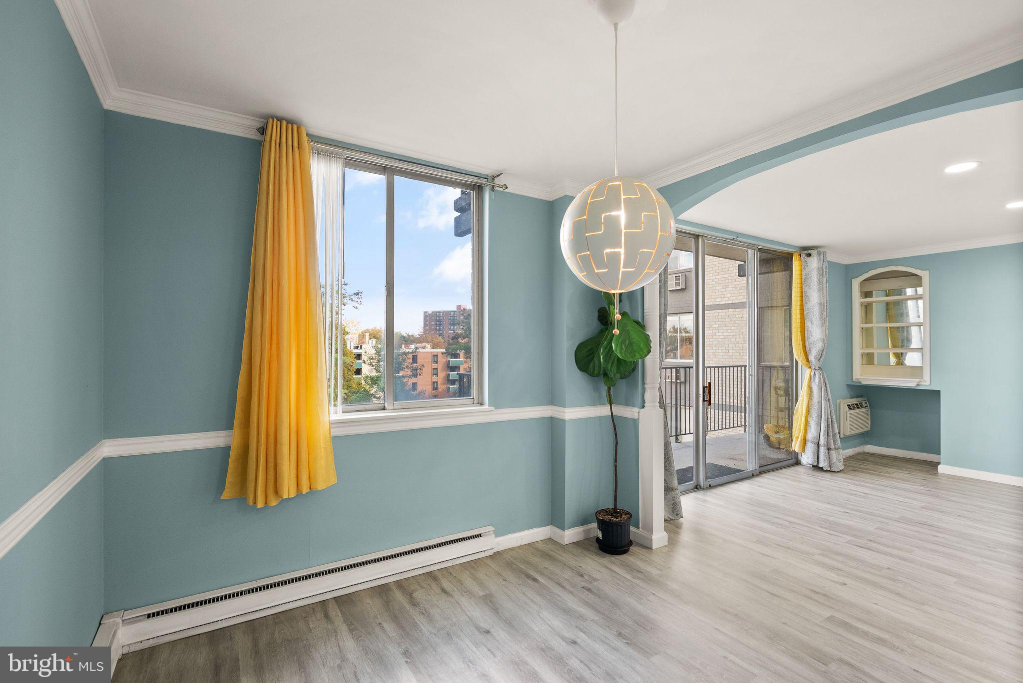 3245 Rio Drive, Unit 608 Falls Church, VA 22041 - Photo 19 of 36 a view of empty room with wooden floor and fan