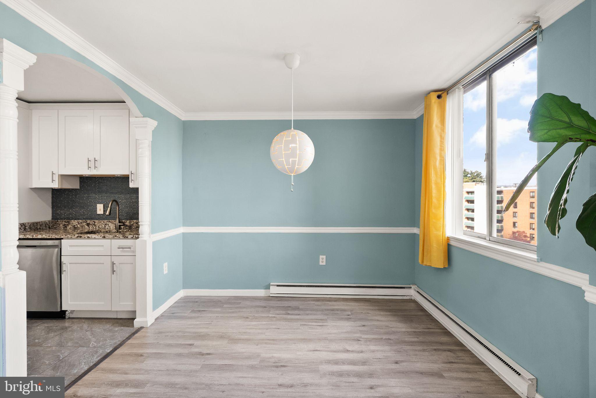 3245 Rio Drive, Unit 608 Falls Church, VA 22041 - Photo 21 of 36 a view of a kitchen with wooden floor and a window