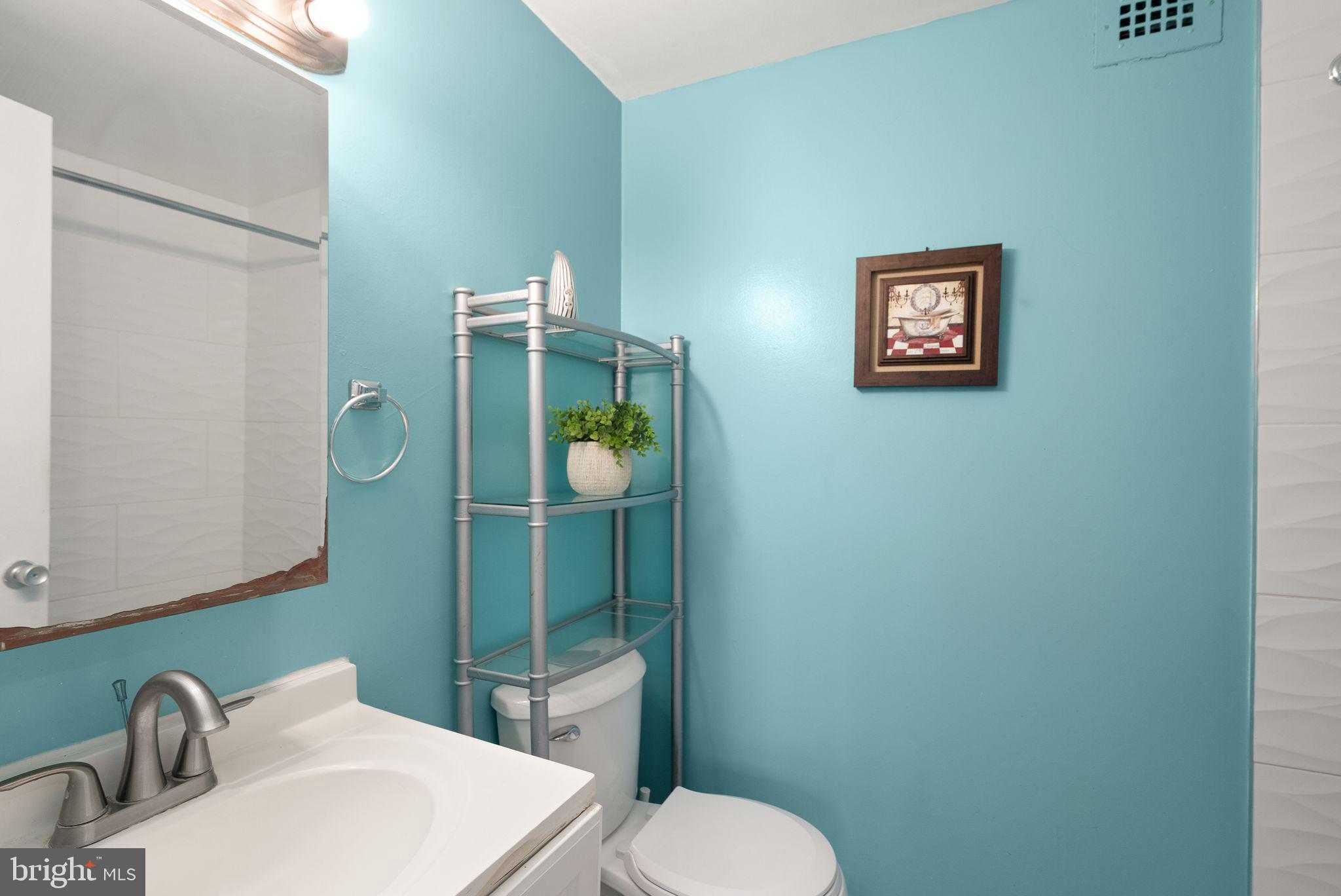 3245 Rio Drive, Unit 608 Falls Church, VA 22041 - Photo 28 of 36 a bathroom with a toilet sink and mirror