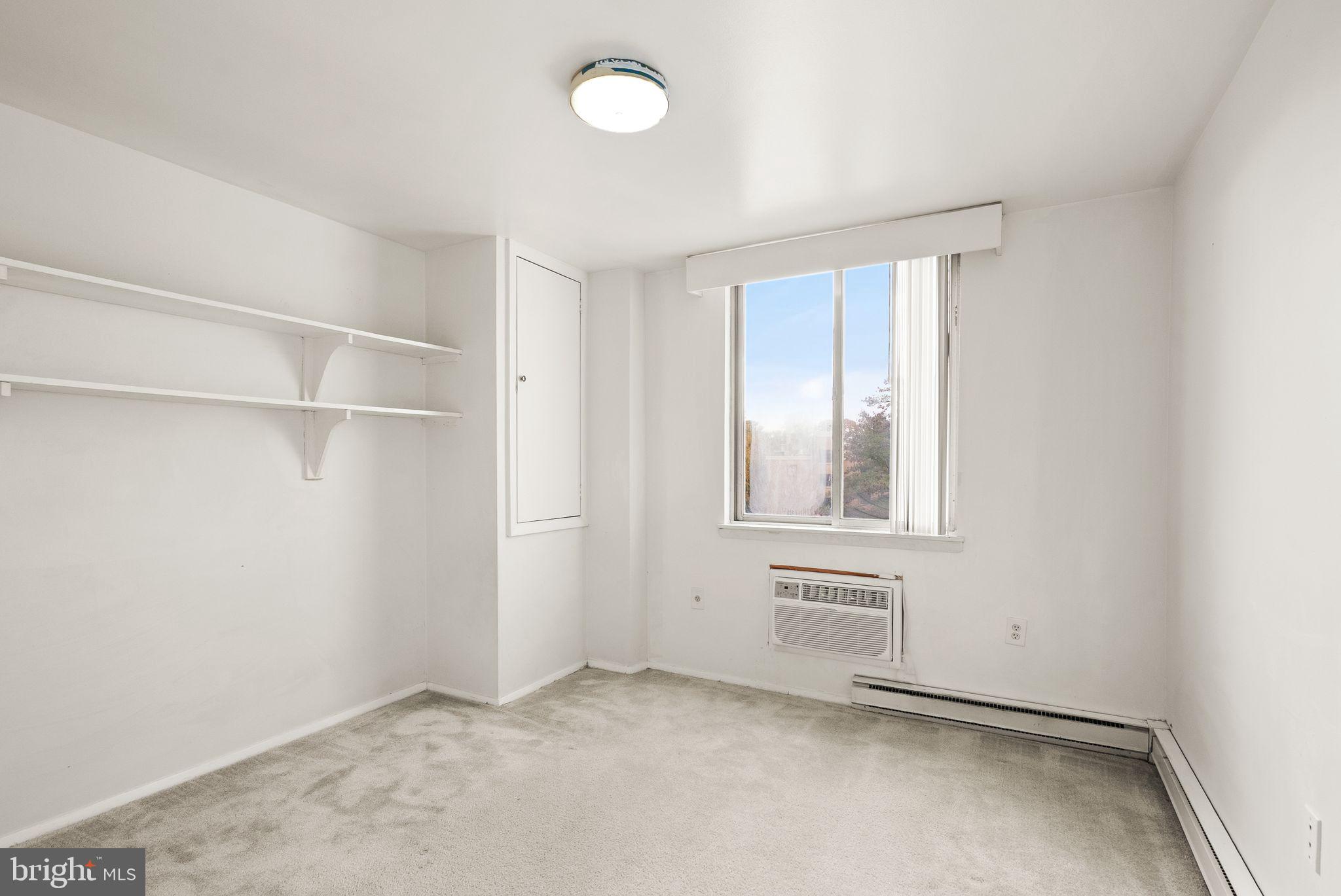 3245 Rio Drive, Unit 608 Falls Church, VA 22041 - Photo 29 of 36 a view of an empty room with a window