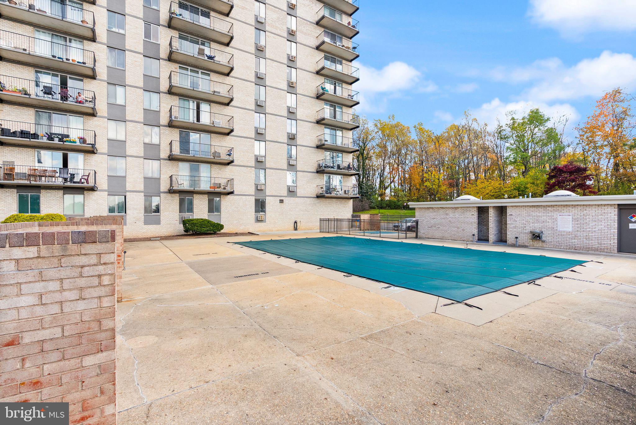 3245 Rio Drive, Unit 608 Falls Church, VA 22041 - Photo 33 of 36 a view of a building with a yard