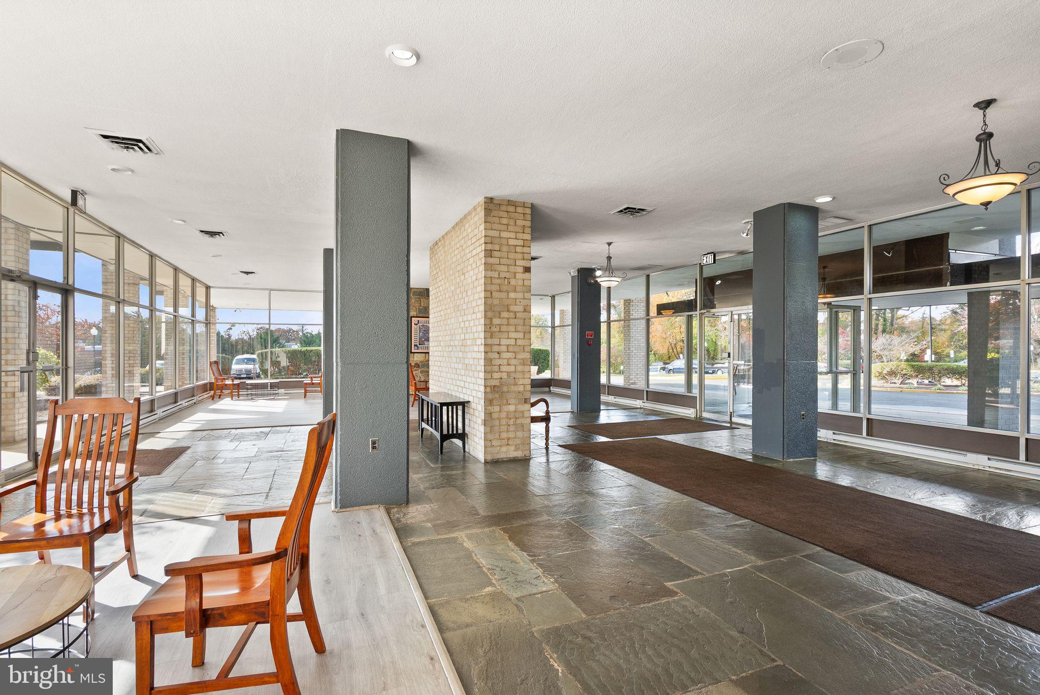 3245 Rio Drive, Unit 608 Falls Church, VA 22041 - Photo 7 of 36 a dining room with furniture and large windows