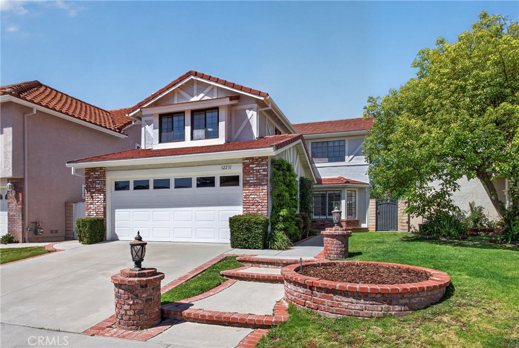 12231 Eagle Ridge Way Porter Ranch, CA 91326 - Photo 1 of 65 a front view of a house with a yard