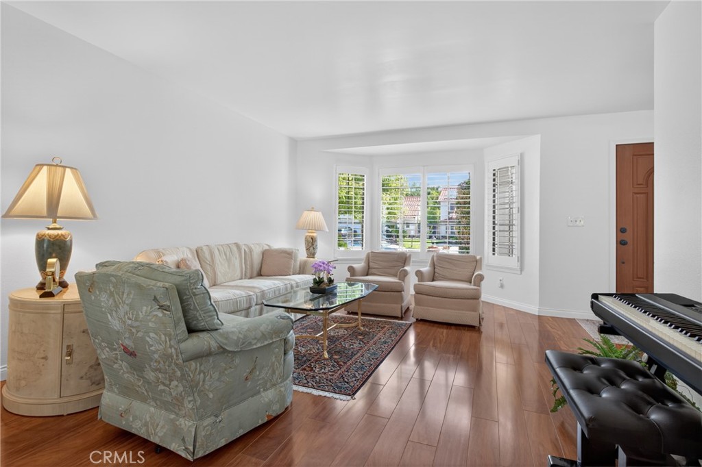 12231 Eagle Ridge Way Porter Ranch, CA 91326 - Photo 12 of 65 a living room with furniture and a wooden floor