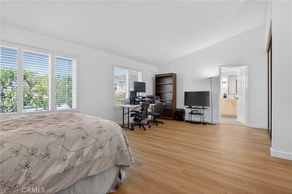 12231 Eagle Ridge Way Porter Ranch, CA 91326 - Photo 20 of 65 a bed room with a bed and a chair