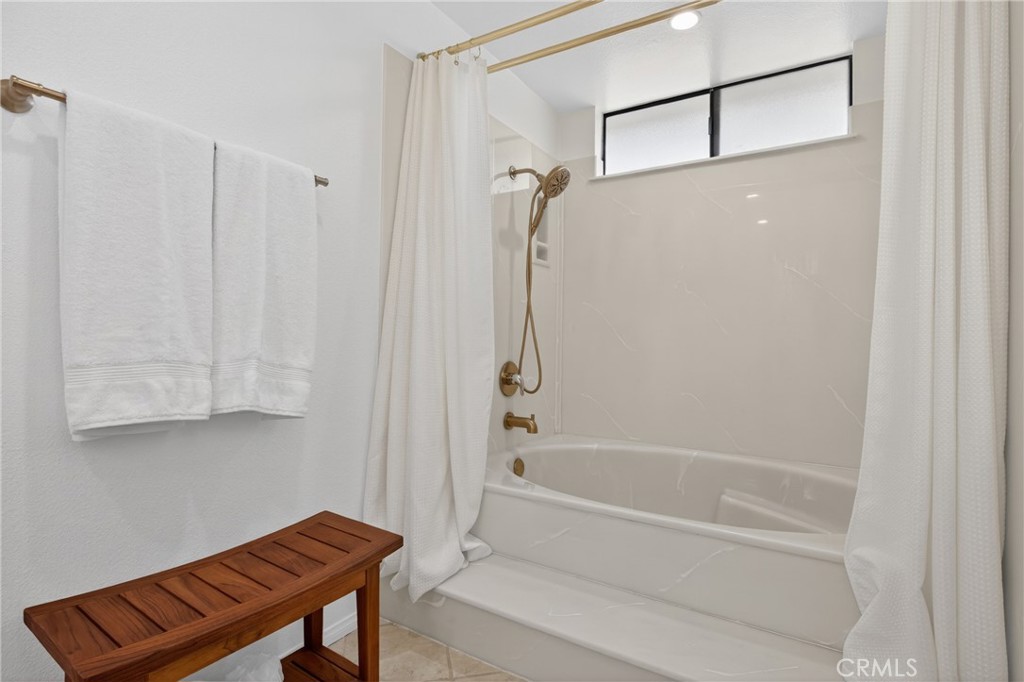 12231 Eagle Ridge Way Porter Ranch, CA 91326 - Photo 26 of 65 a bathroom with a bathtub and a shower