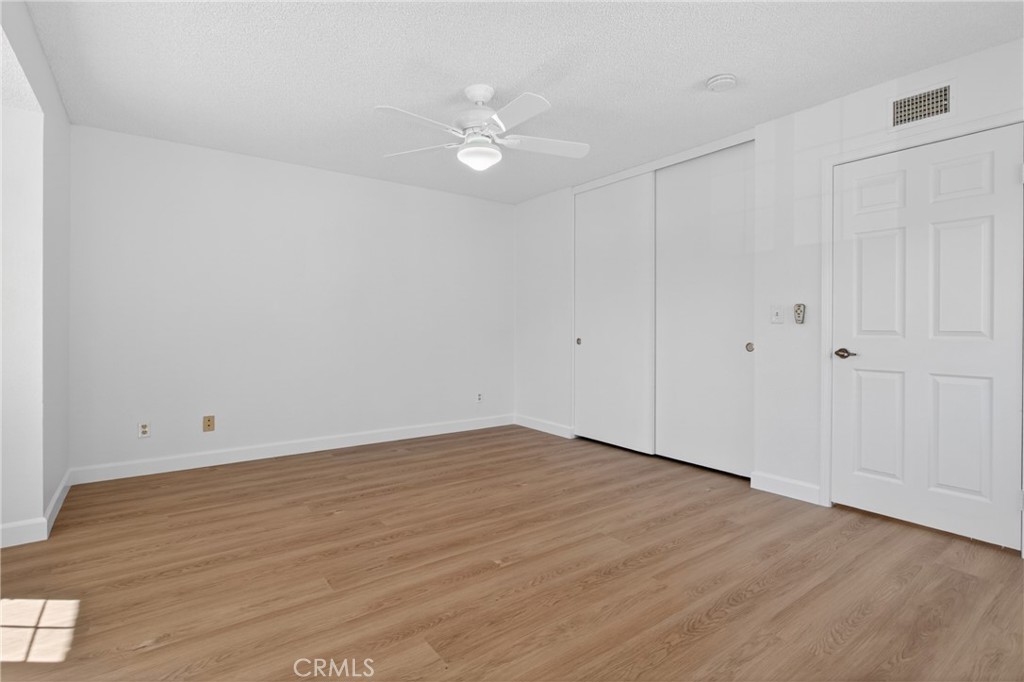 12231 Eagle Ridge Way Porter Ranch, CA 91326 - Photo 30 of 65 a view of an empty room with wooden floor