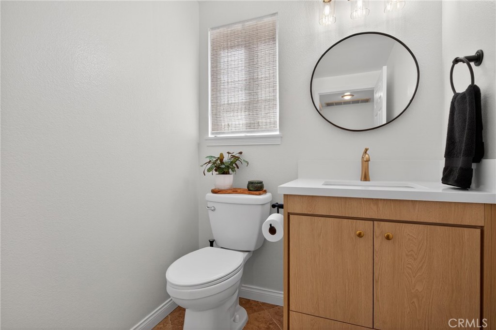 12231 Eagle Ridge Way Porter Ranch, CA 91326 - Photo 36 of 65 a bathroom with a sink a toilet and a mirror