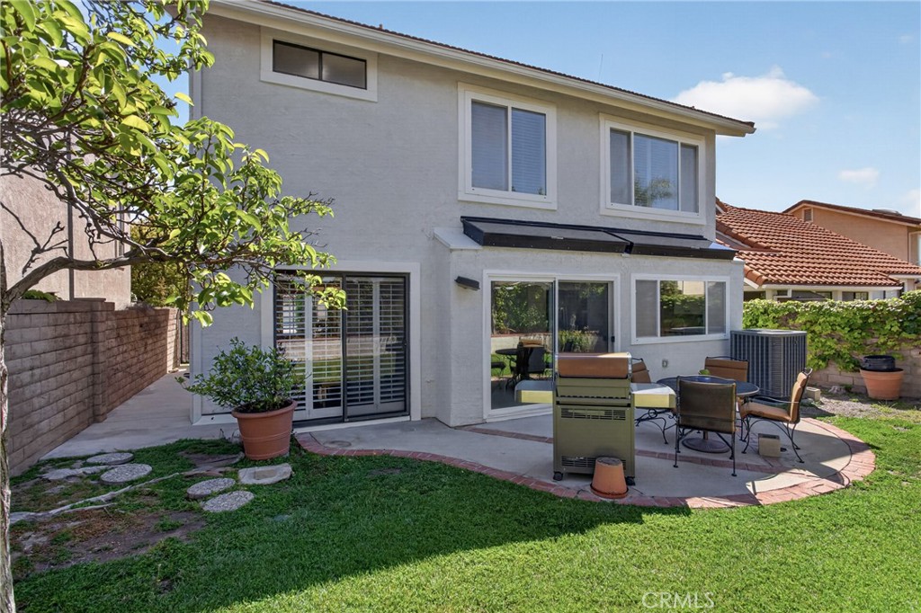 12231 Eagle Ridge Way Porter Ranch, CA 91326 - Photo 41 of 65 a view of a house with backyard sitting area and garden