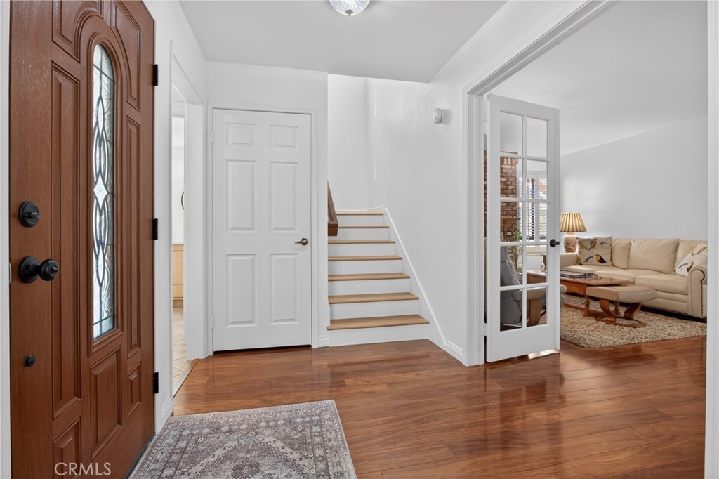 12231 Eagle Ridge Way Porter Ranch, CA 91326 - Photo 57 of 65 a view of a livingroom with wooden floor and white walls