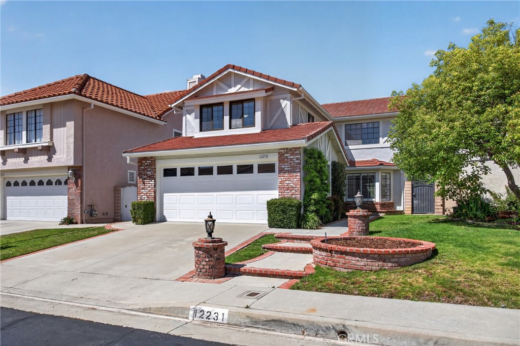 12231 Eagle Ridge Way Porter Ranch, CA 91326 - Photo 61 of 65 front view of a house with a yard