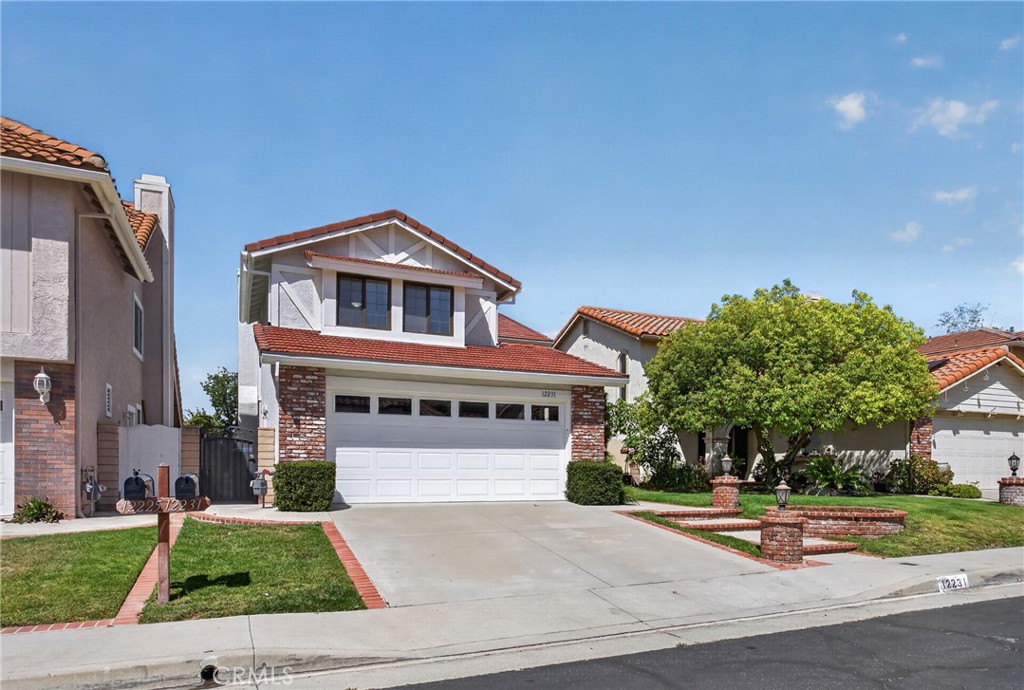 12231 Eagle Ridge Way Porter Ranch, CA 91326 - Photo 64 of 65 a front view of a house with a yard