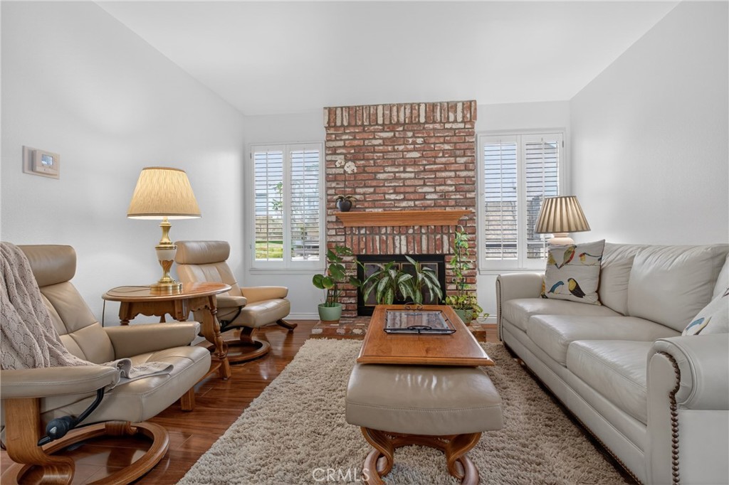 12231 Eagle Ridge Way Porter Ranch, CA 91326 - Photo 7 of 65 a living room with furniture and a lamp
