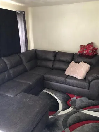 a living room with furniture and a couch
