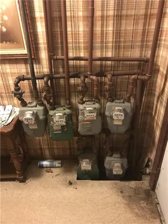 a room with water heater and a window