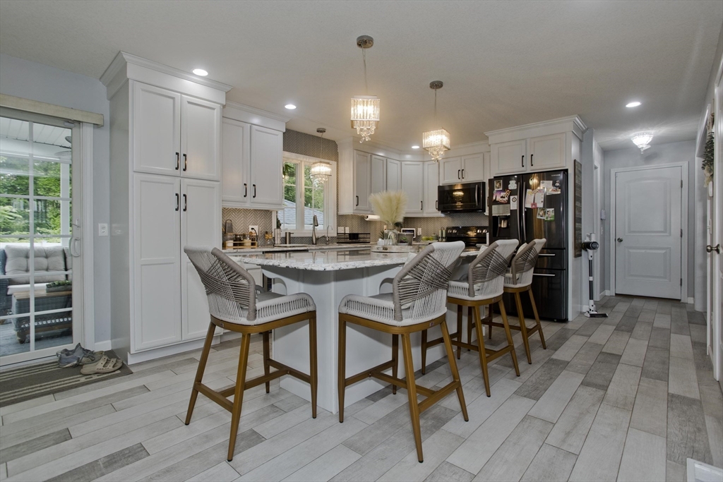 210 Naismith Street Springfield, MA 01104 - Photo 11 of 42 a view of a dining room with furniture