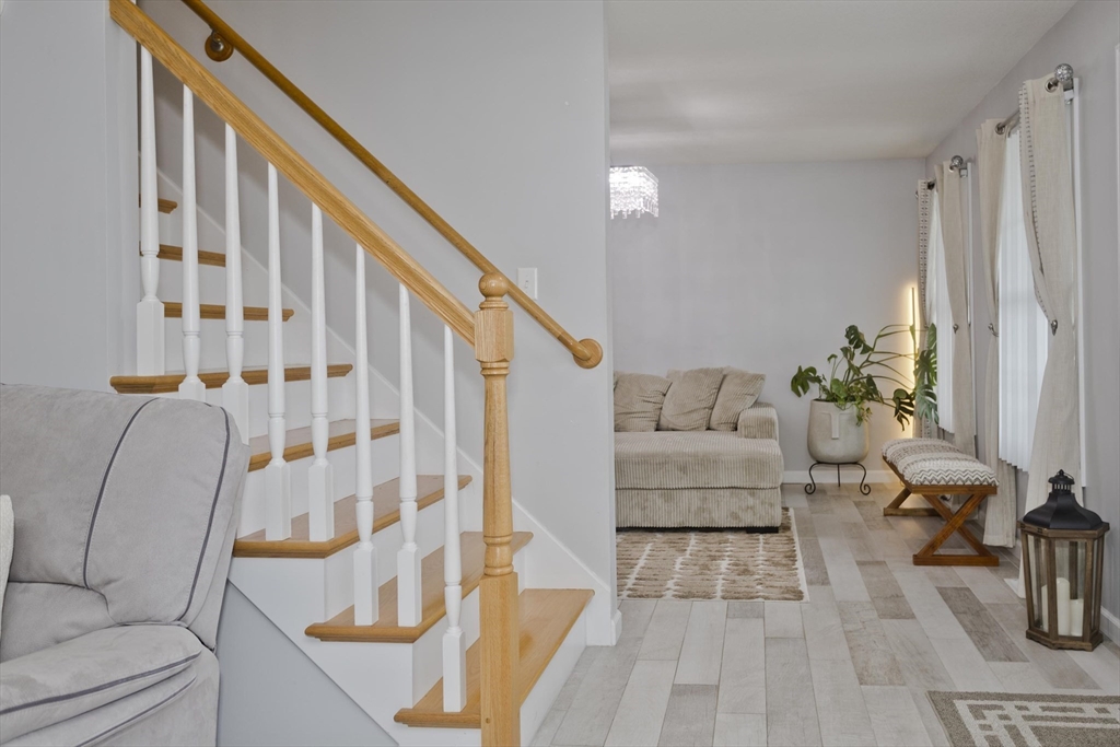 210 Naismith Street Springfield, MA 01104 - Photo 13 of 42 a living room with furniture and a rug
