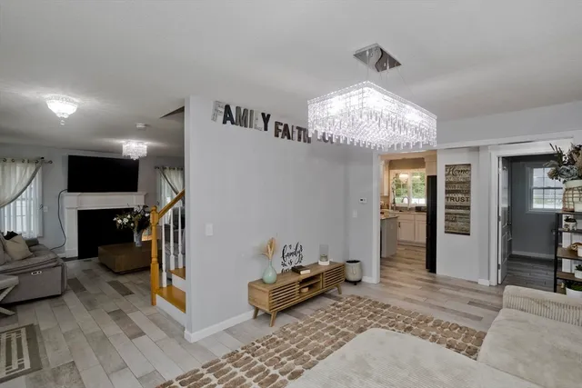 a bedroom with furniture and a chandelier