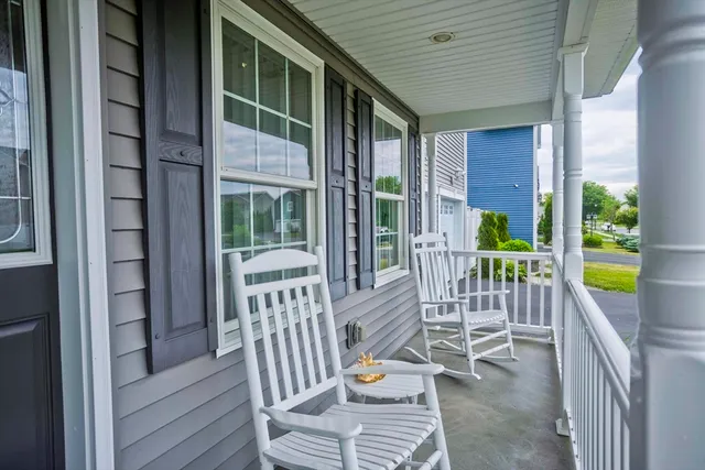 a view of a balcony with chairs