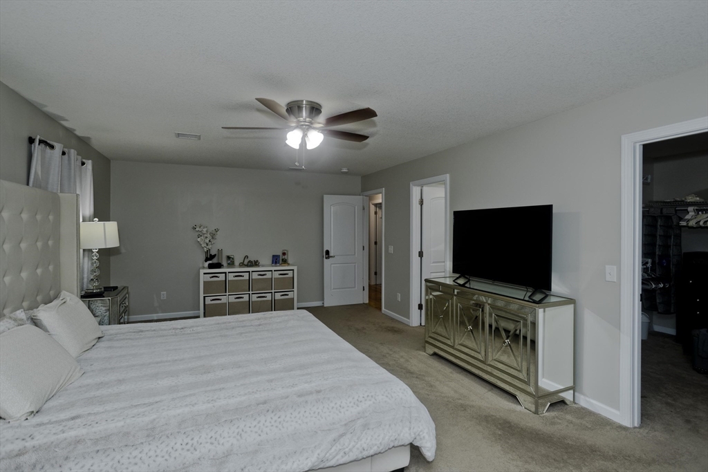 210 Naismith Street Springfield, MA 01104 - Photo 26 of 42 a bedroom with furniture and flat screen tv