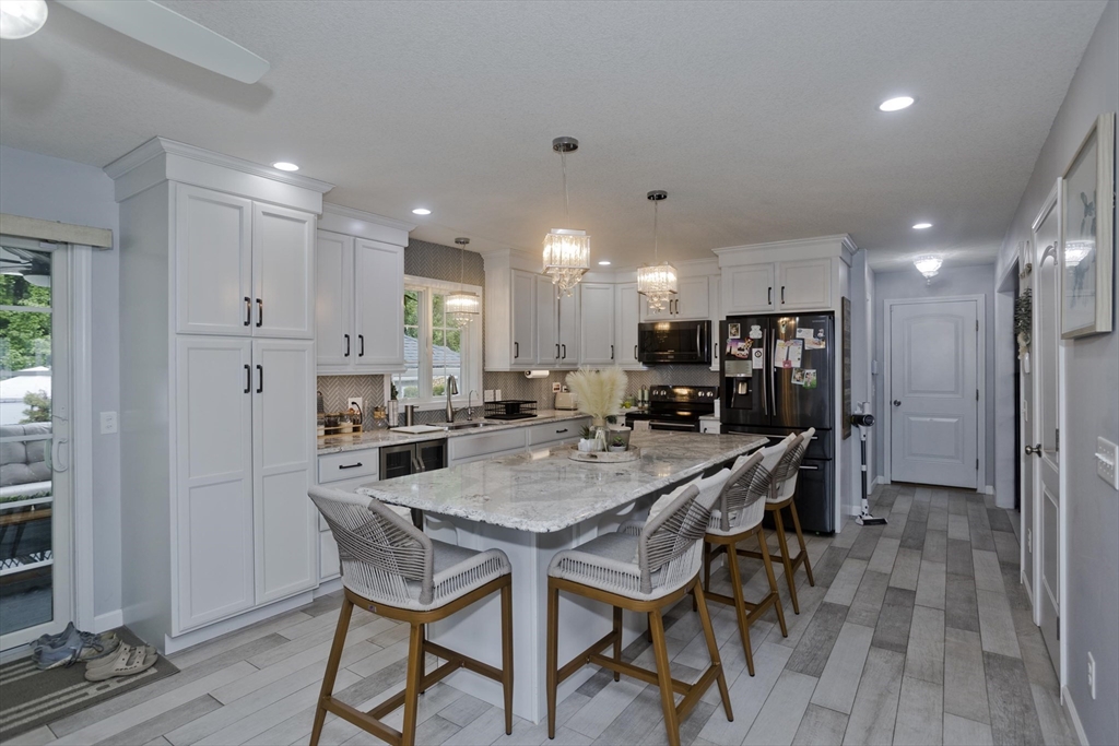 210 Naismith Street Springfield, MA 01104 - Photo 7 of 42 a view of a dining room with furniture