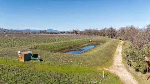 a view of a lake with a yard