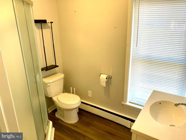 a view of a porch with furniture and a yard