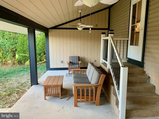 a view of backyard with jacuzzi
