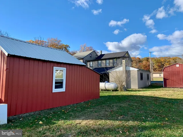 a view of a backyard with potted plants