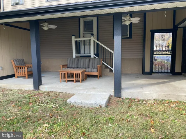 a view of a house with a yard and garage