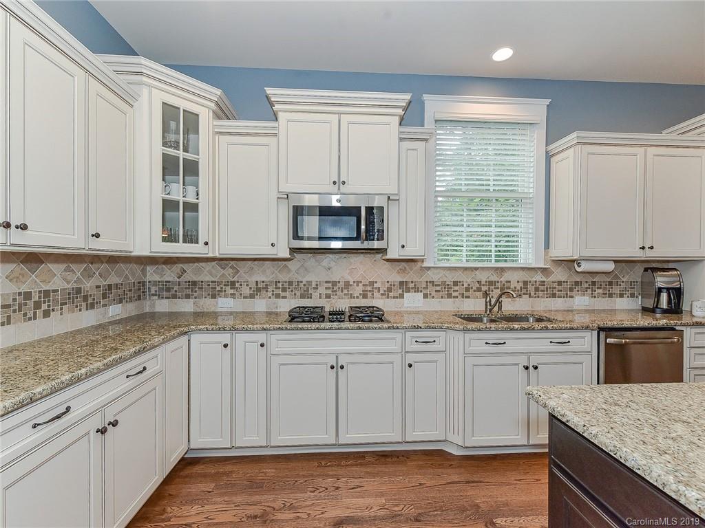313 Olmstead Street Fort Mill, SC 29708 - Photo 13 of 48 a kitchen with sink cabinets and window