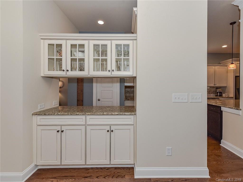 313 Olmstead Street Fort Mill, SC 29708 - Photo 15 of 48 a kitchen with a sink and cabinets