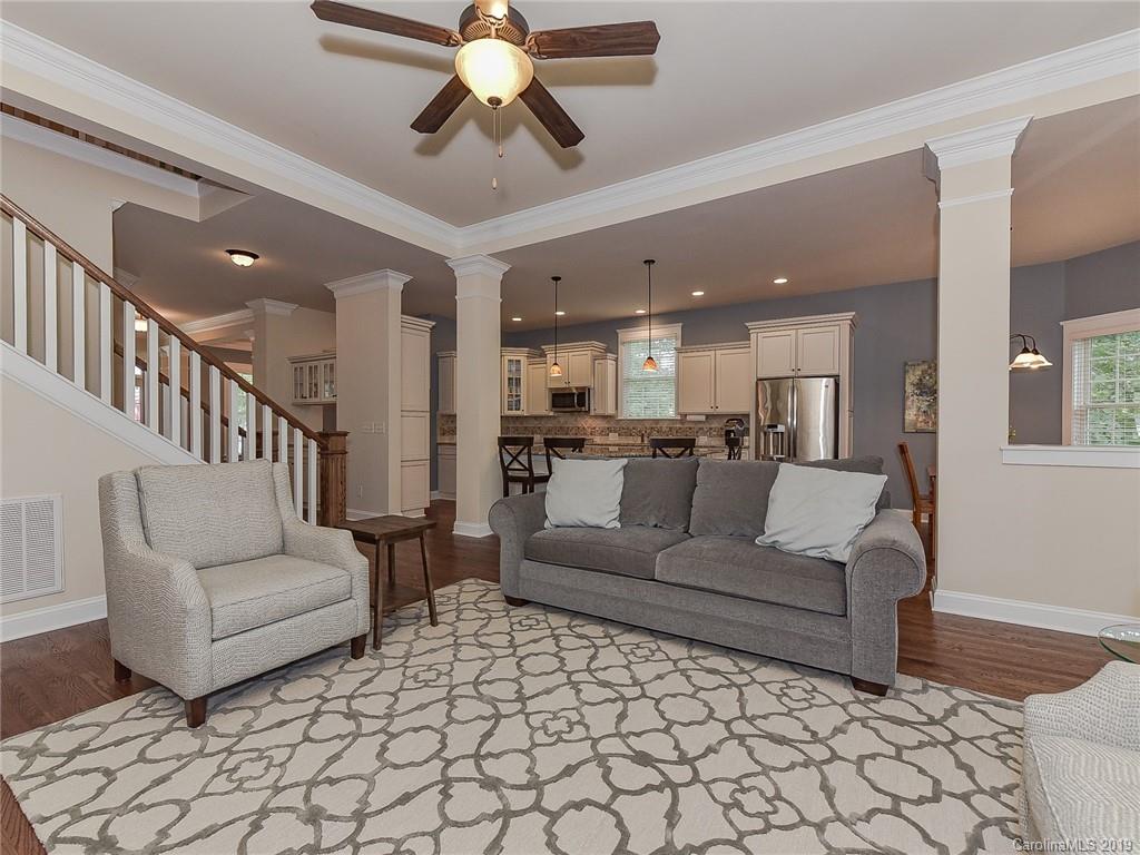 313 Olmstead Street Fort Mill, SC 29708 - Photo 20 of 48 a living room with furniture and a chandelier