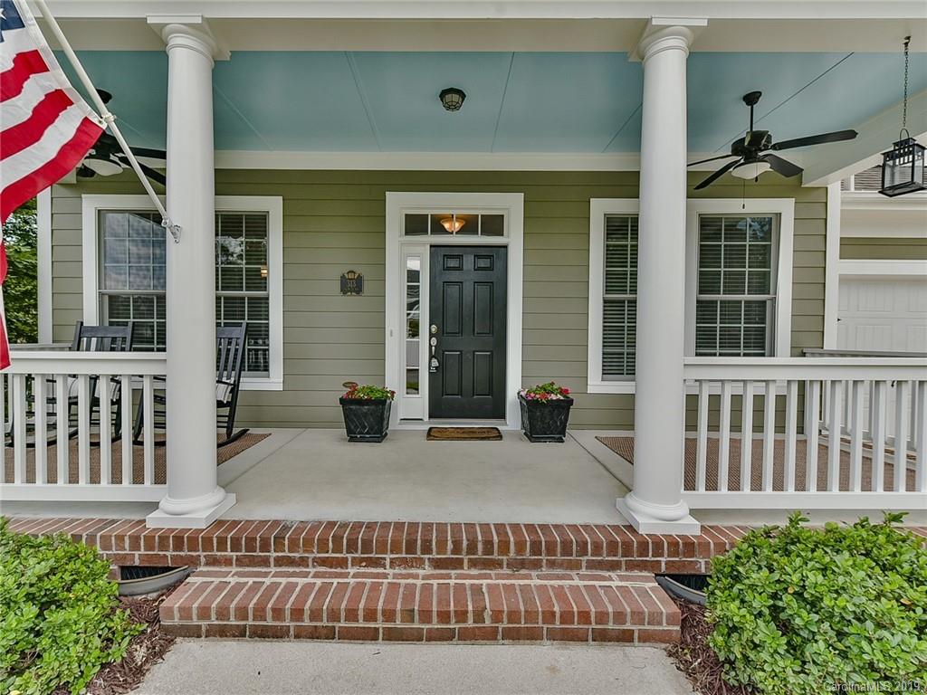 313 Olmstead Street Fort Mill, SC 29708 - Photo 3 of 48 front view of a house with a bench