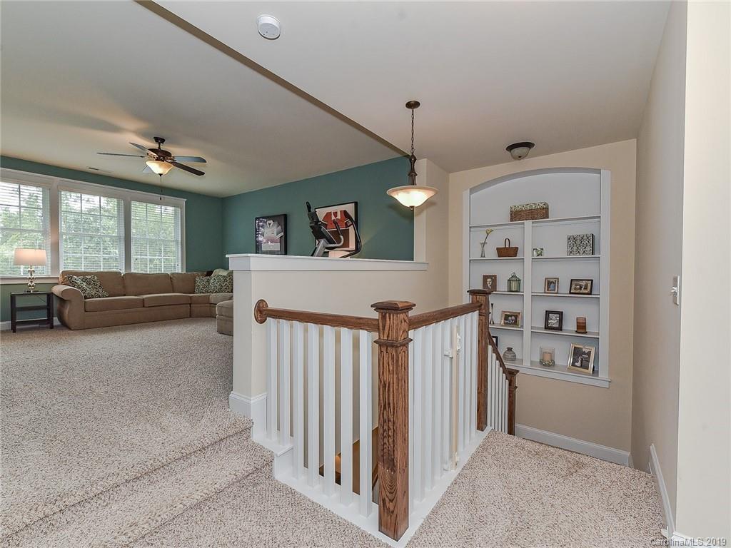 313 Olmstead Street Fort Mill, SC 29708 - Photo 24 of 48 a view of a livingroom with furniture and staircase
