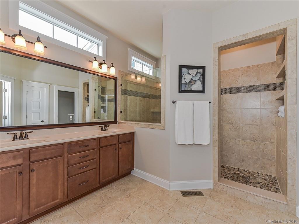 313 Olmstead Street Fort Mill, SC 29708 - Photo 30 of 48 a spacious bathroom with a double vanity sink a mirror and shower